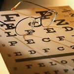 Image of eye chart and pair of glasses